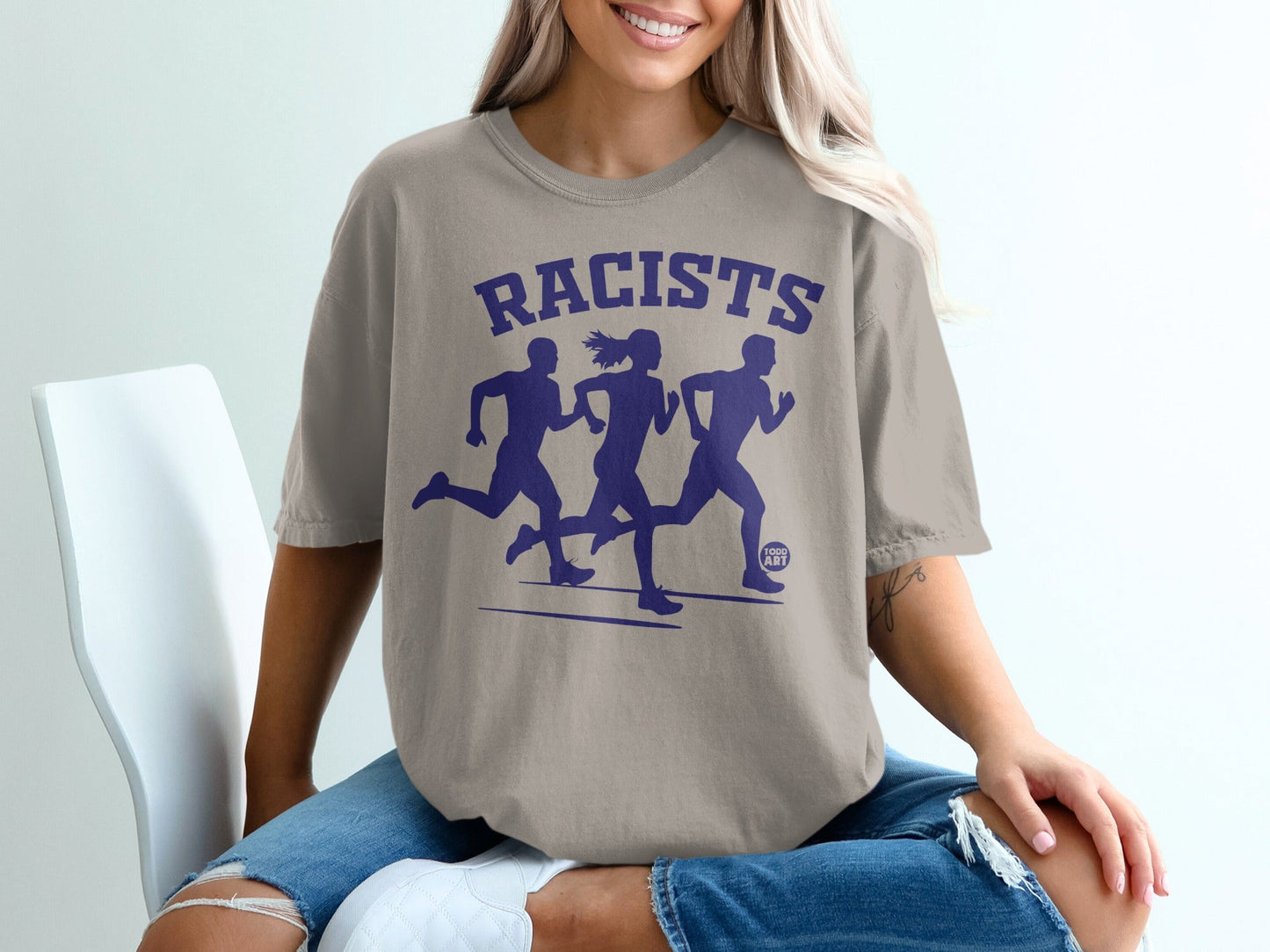 T-shirt with graphic of three runners and "RACISTS" text.