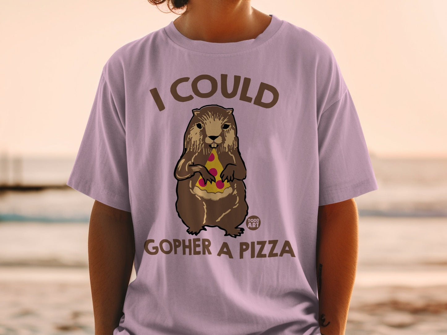 Gopher holding pizza slice on a light purple t-shirt.