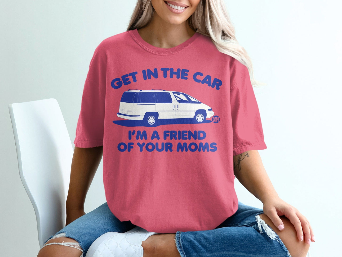 Pink t-shirt with blue text "GET IN THE CAR I'M A FRIEND OF YOUR MOMS" and a van illustration.