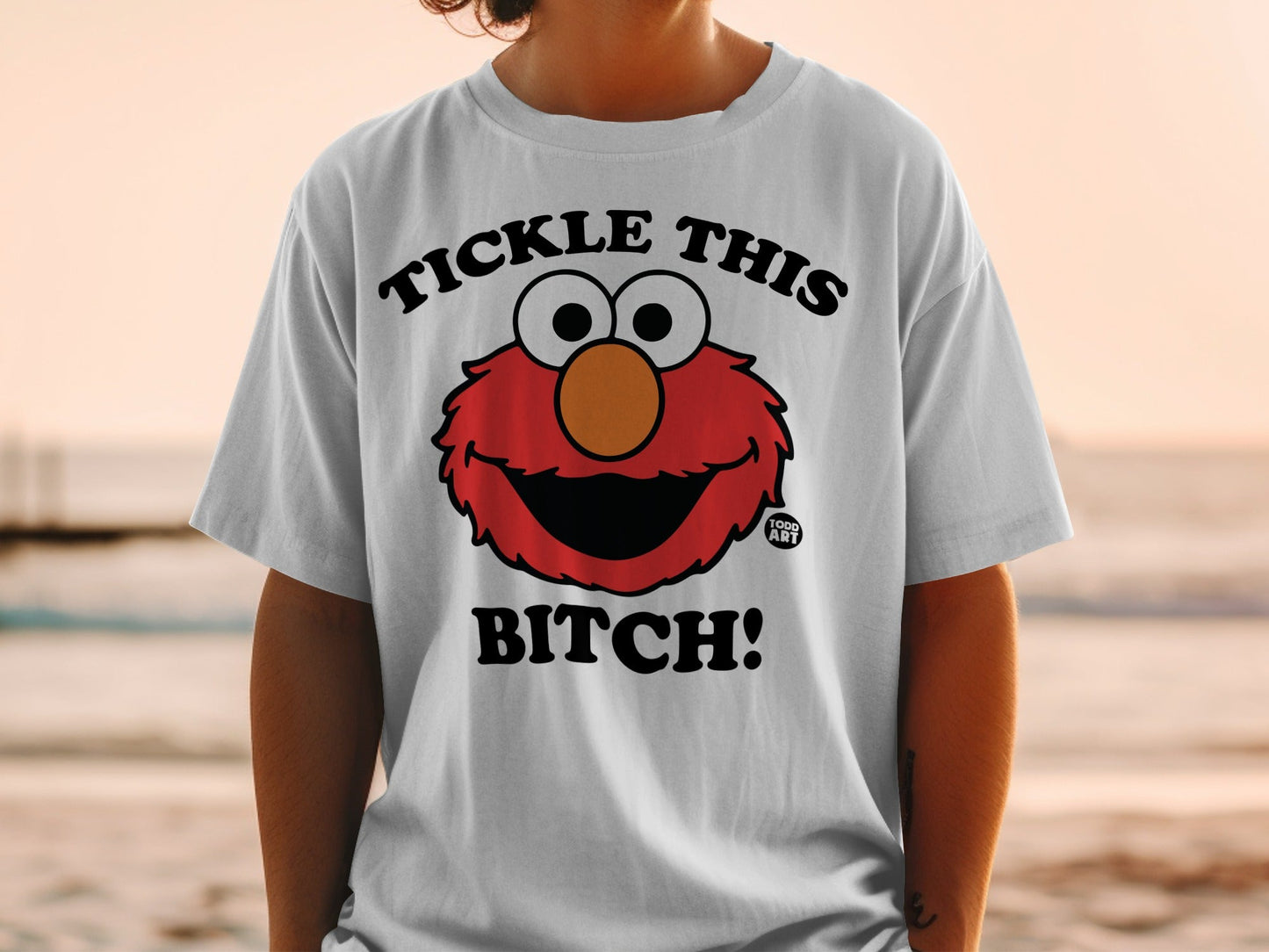 Elmo graphic t-shirt with "Tickle This Bitch!" text.