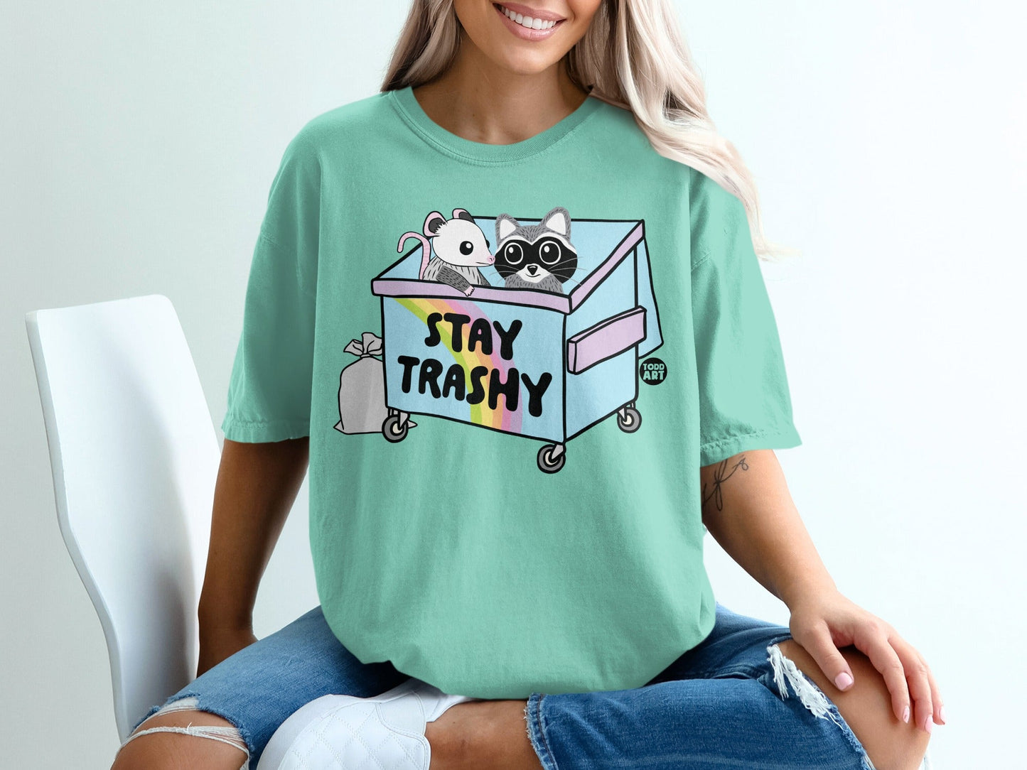 T-shirt with trash can graphic, raccoon, and mouse, "STAY TRASHY" text.