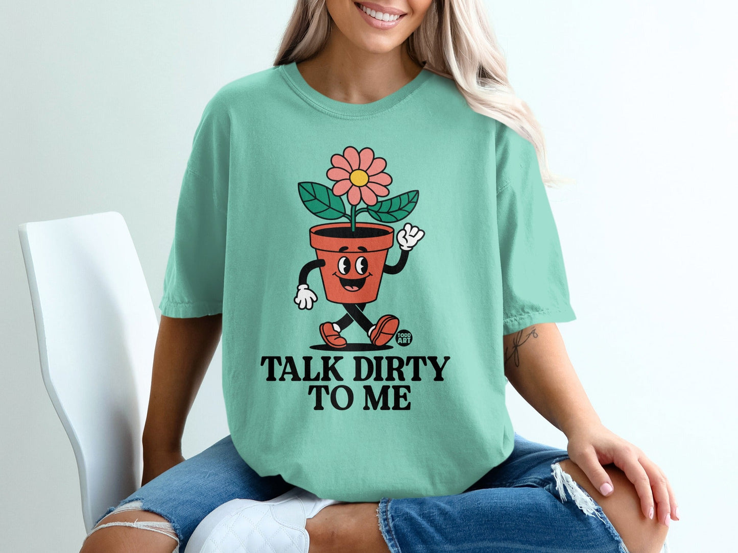 Mint t-shirt with cartoon flower in pot saying "Talk Dirty To Me".