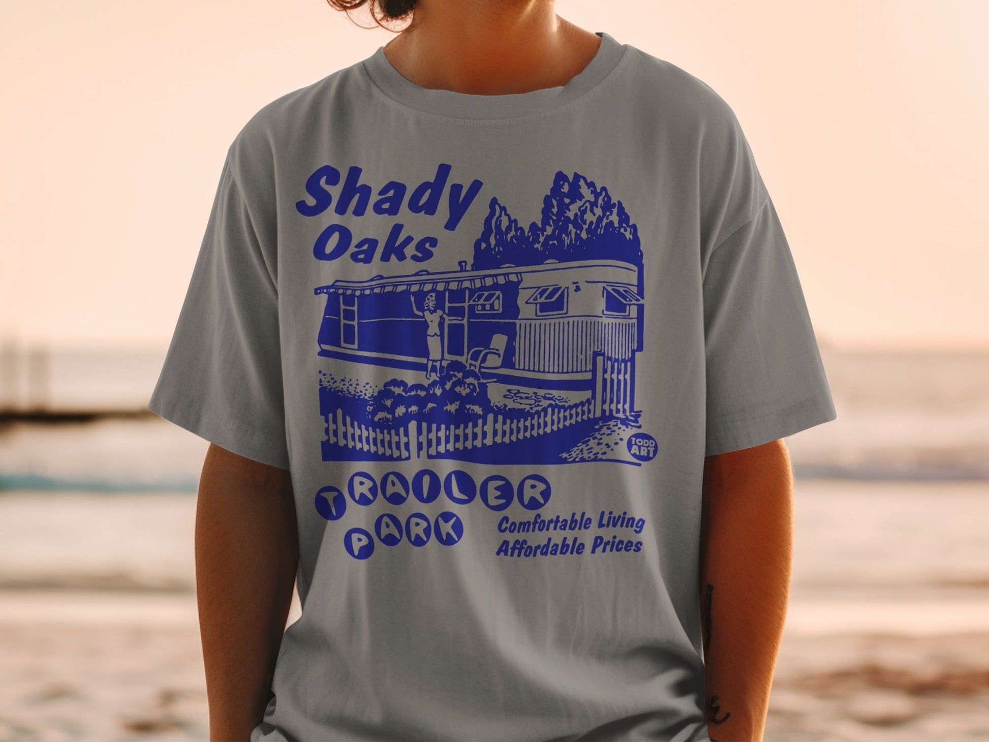 Shady Oaks Trailer Park t-shirt with blue graphic.