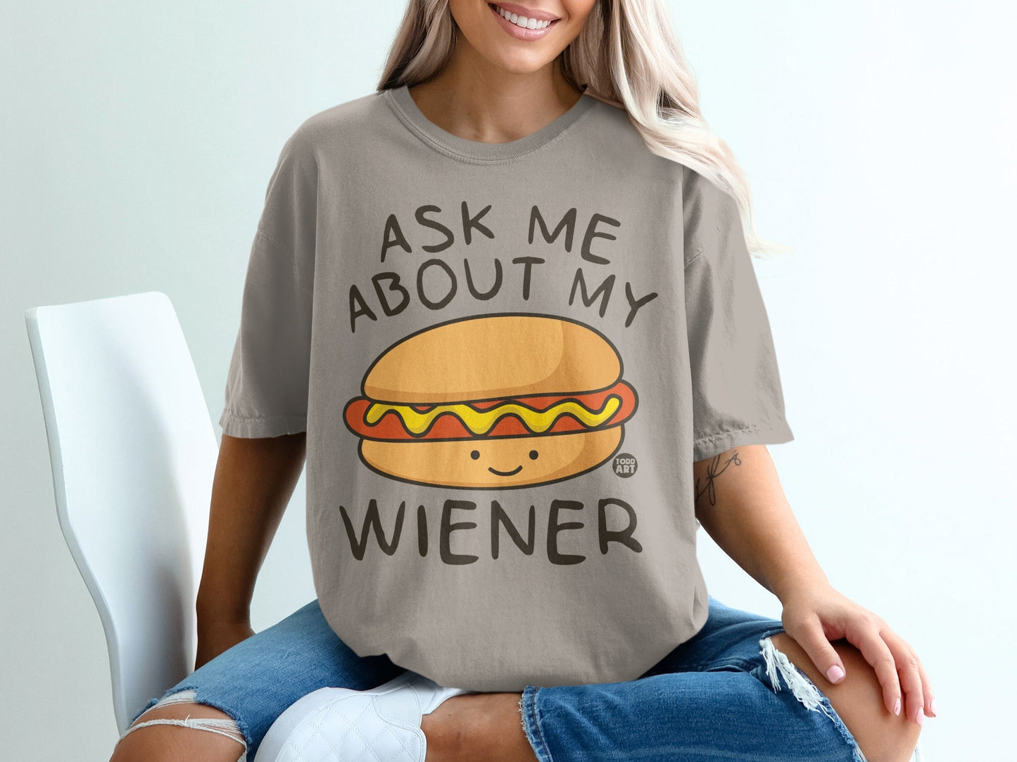 Gray t-shirt with "ASK ME ABOUT MY WIENER" text and a cartoon hot dog.