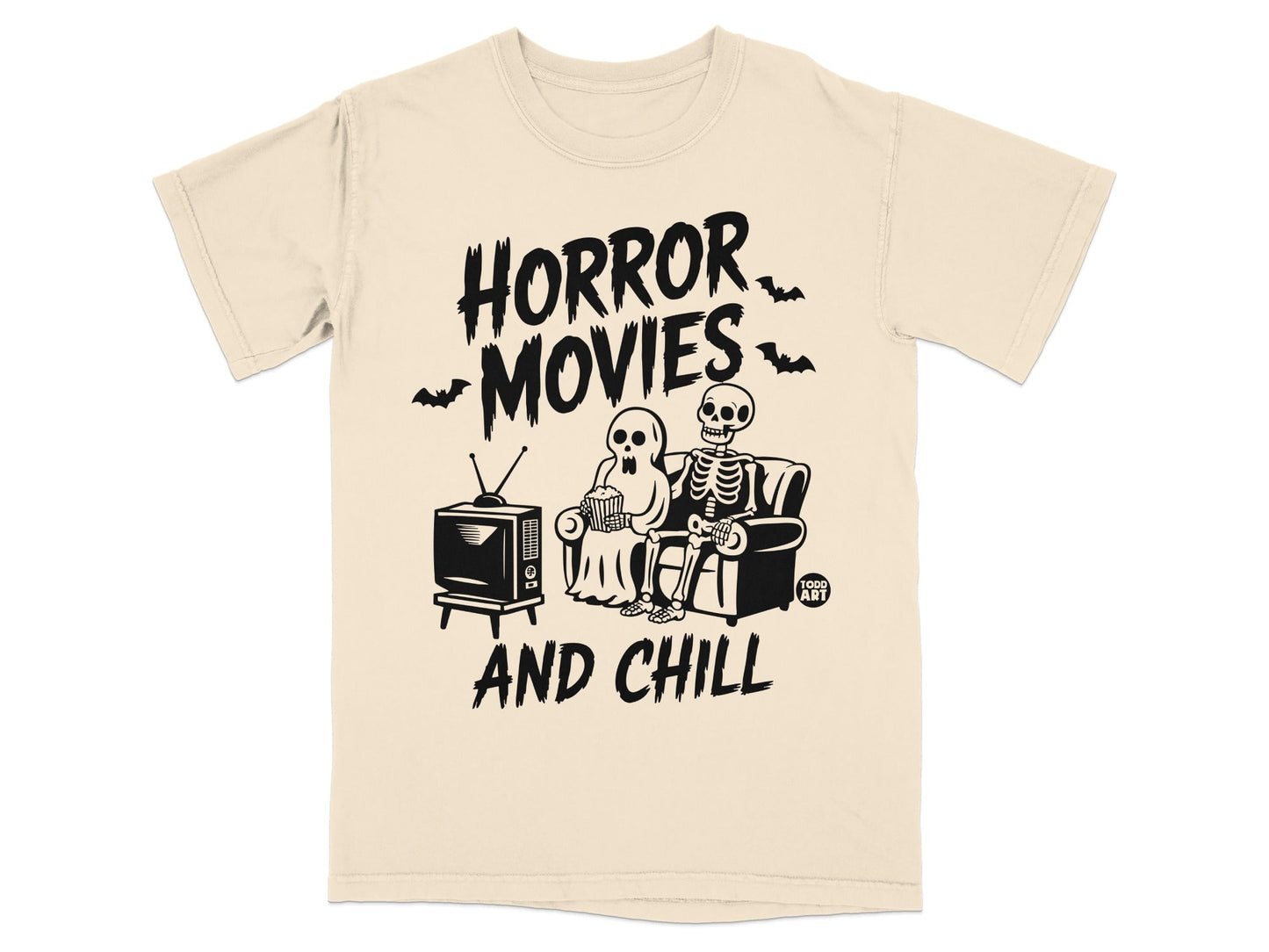 Cream t-shirt with "HORROR MOVIES AND CHILL" and skeleton couple watching TV.