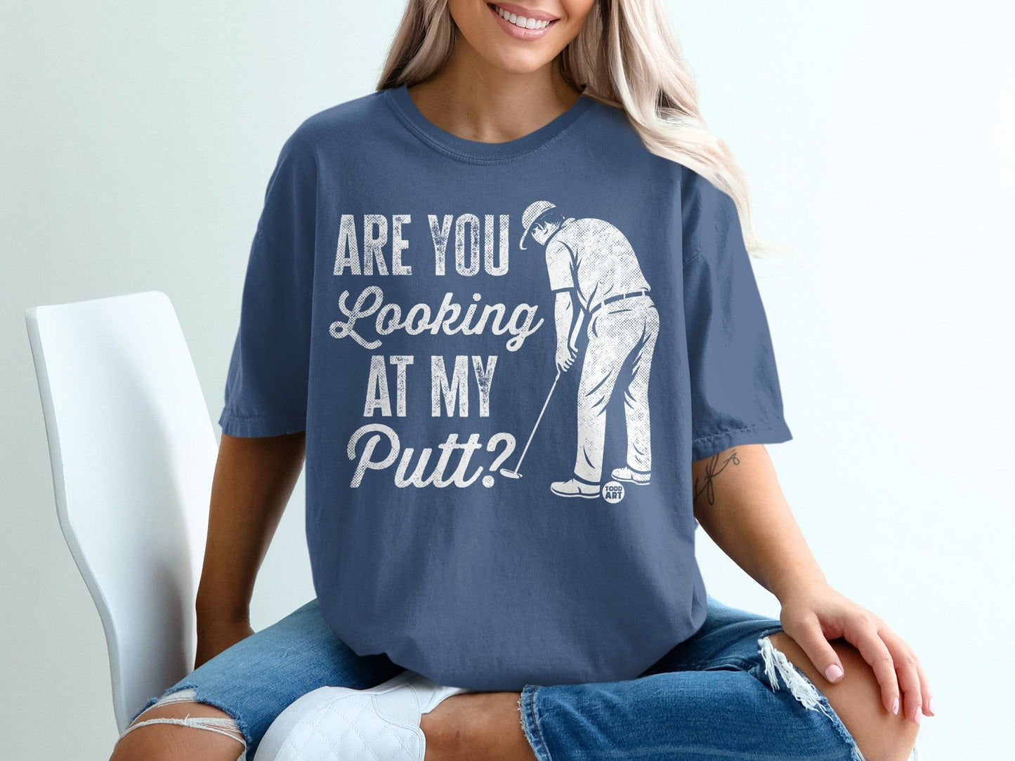 Blue t-shirt with "Are you looking at my putt?" golf graphic.