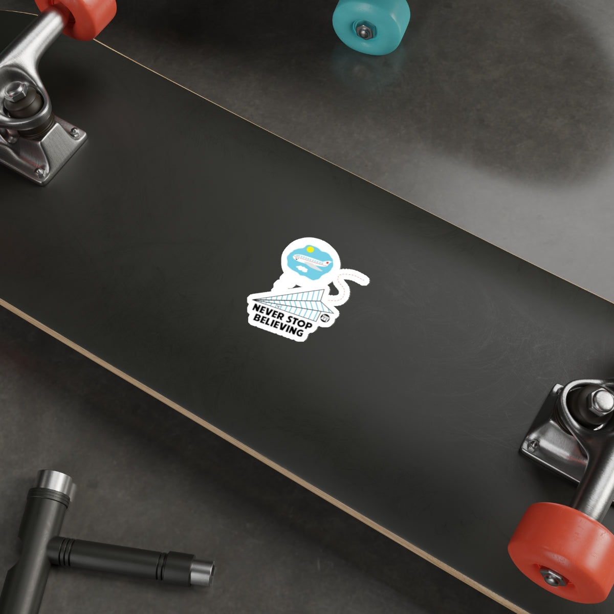 Never Stop Believing Robot Astronaut Sticker on Black Deck