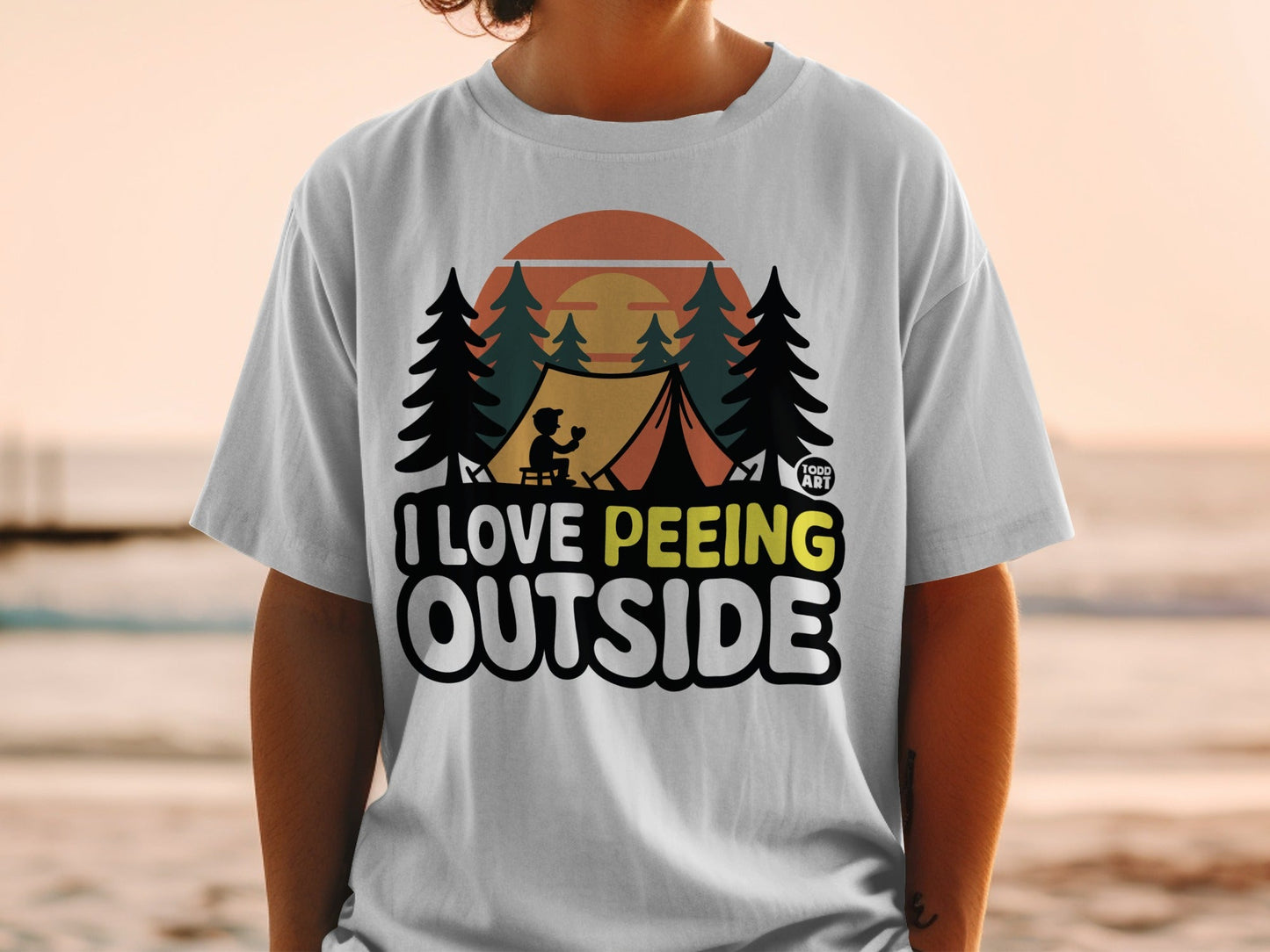 White t-shirt with text "I Love Peeing Outside" and a camping scene.