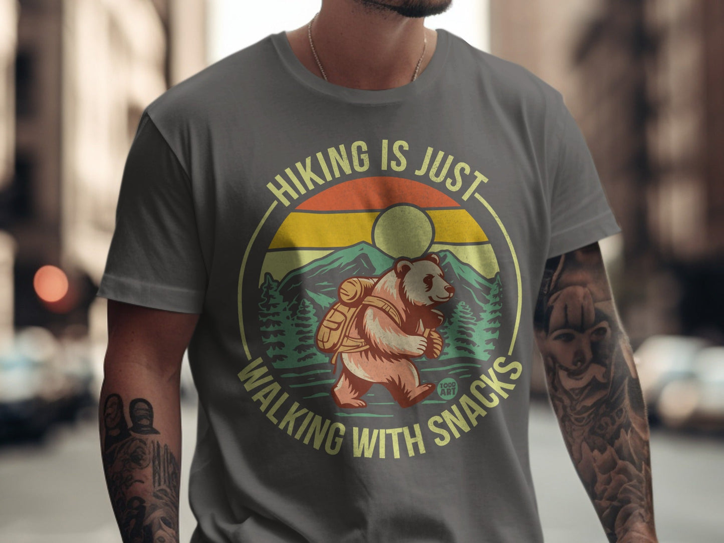 Gray t-shirt with bear, mountains, and "Hiking is just walking with snacks" text.