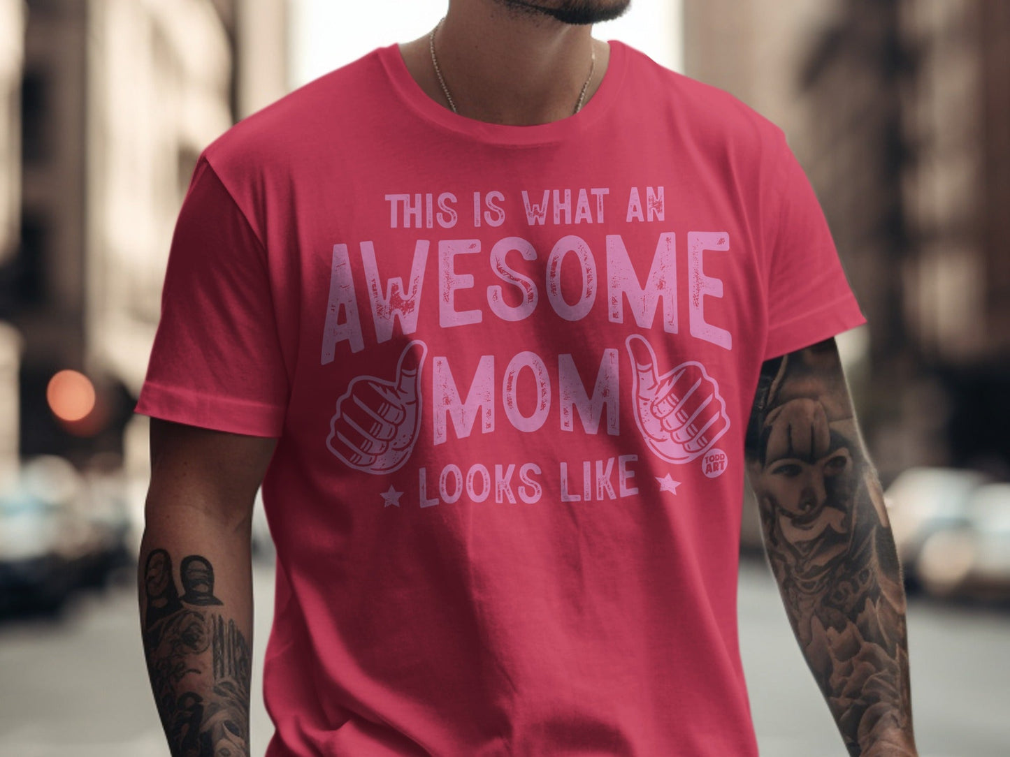 Pink t-shirt with "This is what an awesome mom looks like" text and thumbs-up graphics.