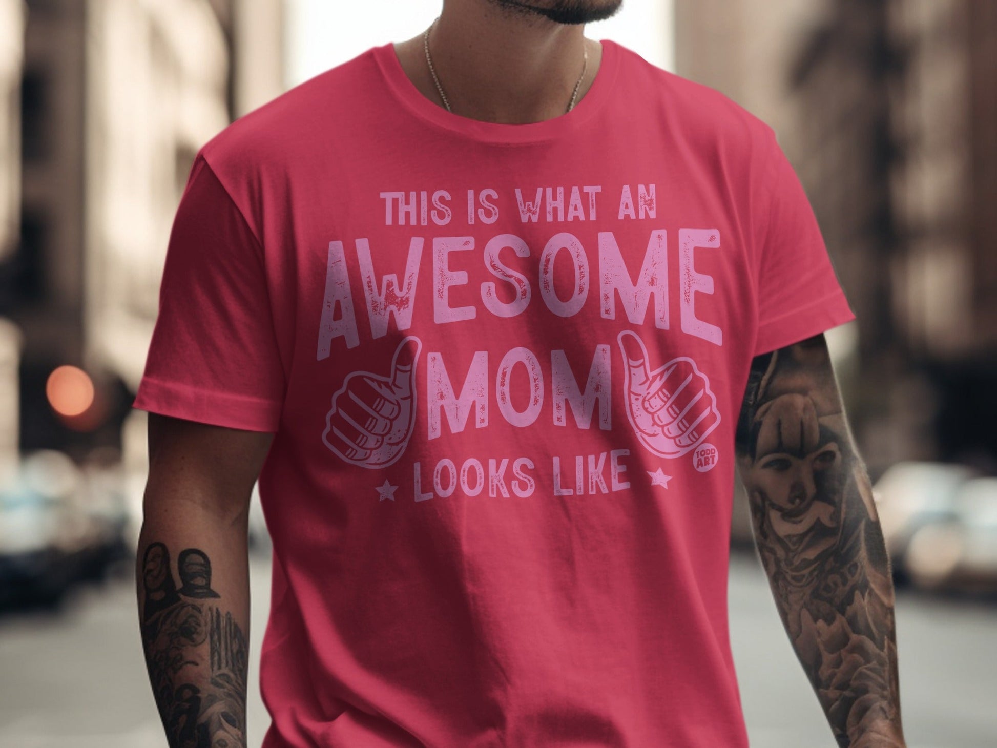 Pink t-shirt with "This is what an awesome mom looks like" text and thumbs-up graphics.