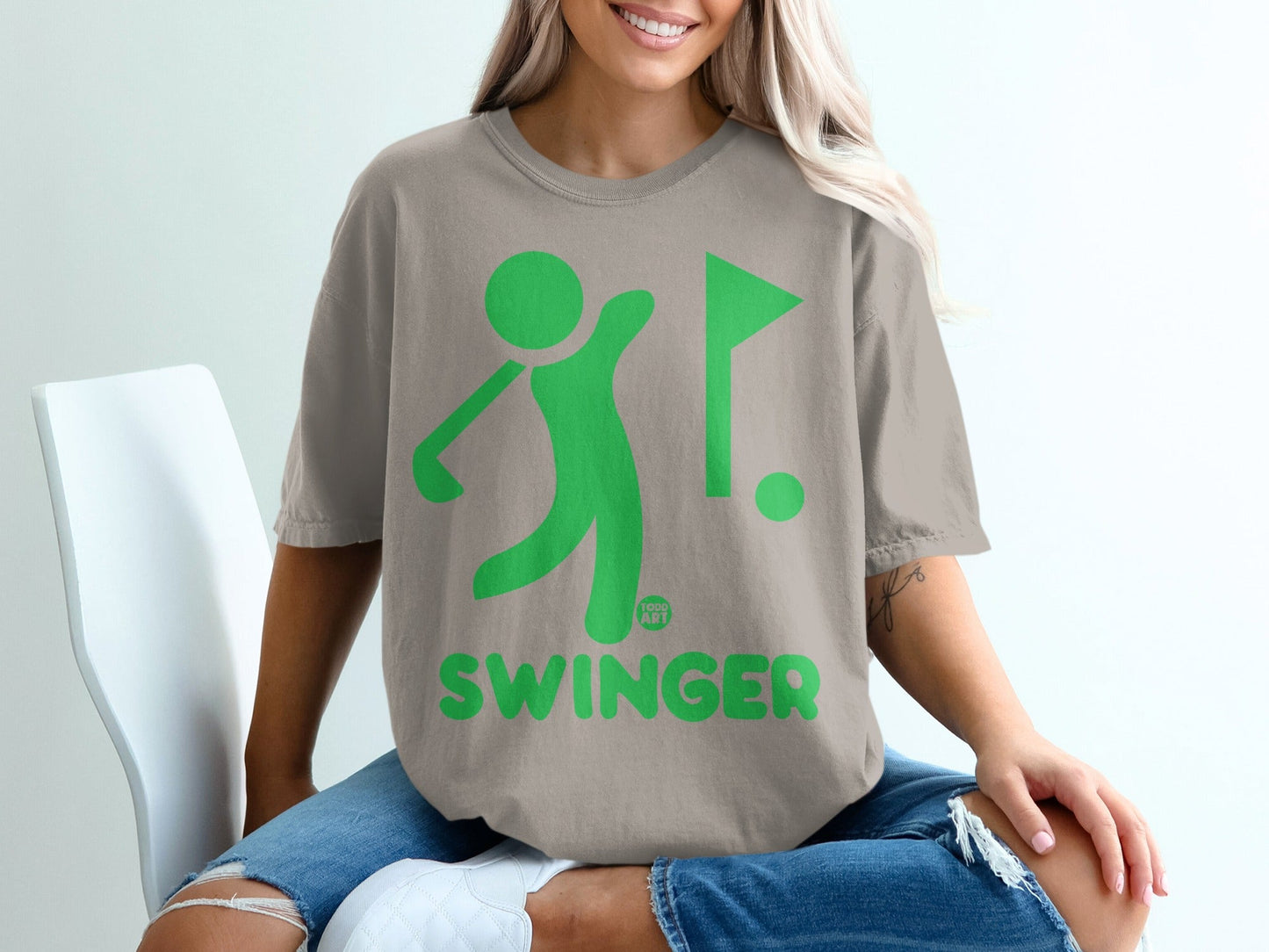 Green golf figure swinging club next to flag, "SWINGER" text below.