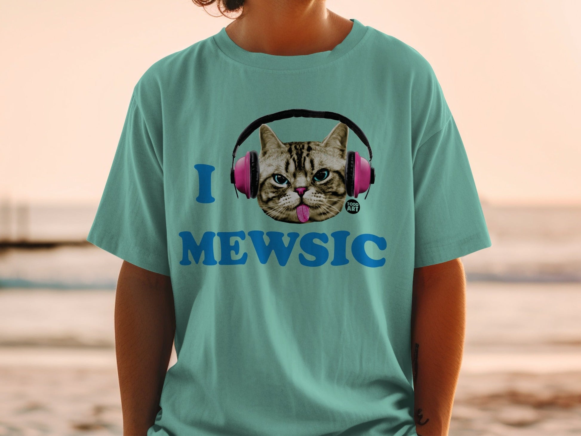 Teal t-shirt with cat wearing headphones and "MEWSIC" text.