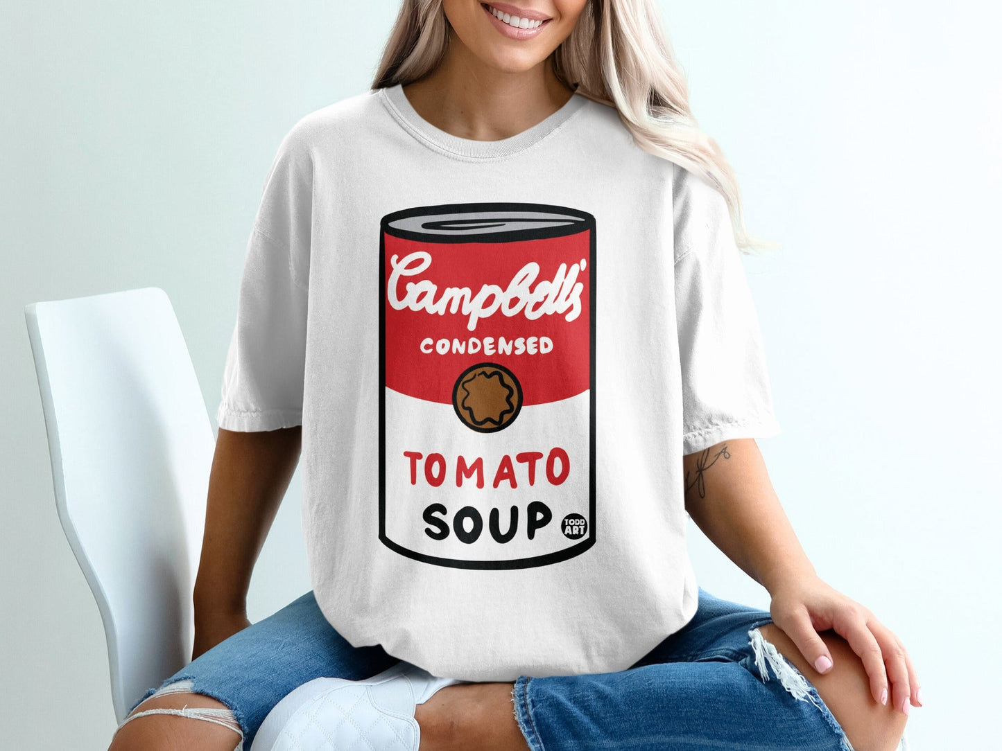 White t-shirt with Campbell's Condensed Tomato Soup can graphic.