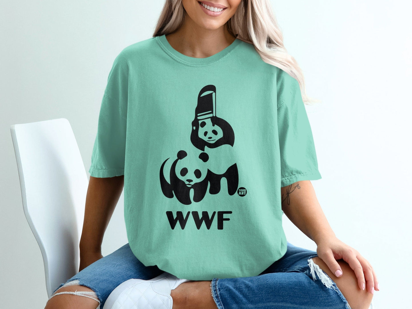 Light teal t-shirt with WWF panda logo and text.