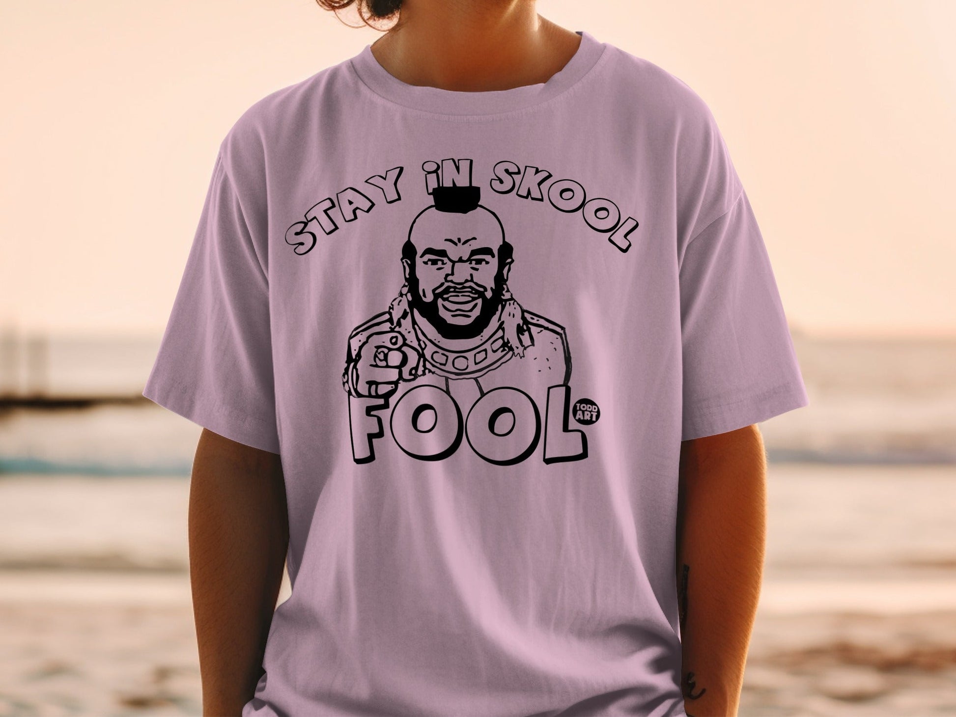 Pink t-shirt featuring Mr. T with "STAY IN SKOOL FOOL" text.
