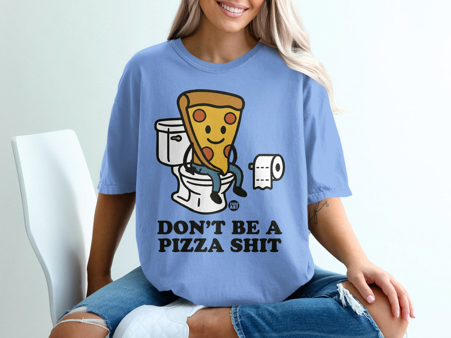 Blue t-shirt with cartoon pizza on toilet, "Don't be pizza shit" text.