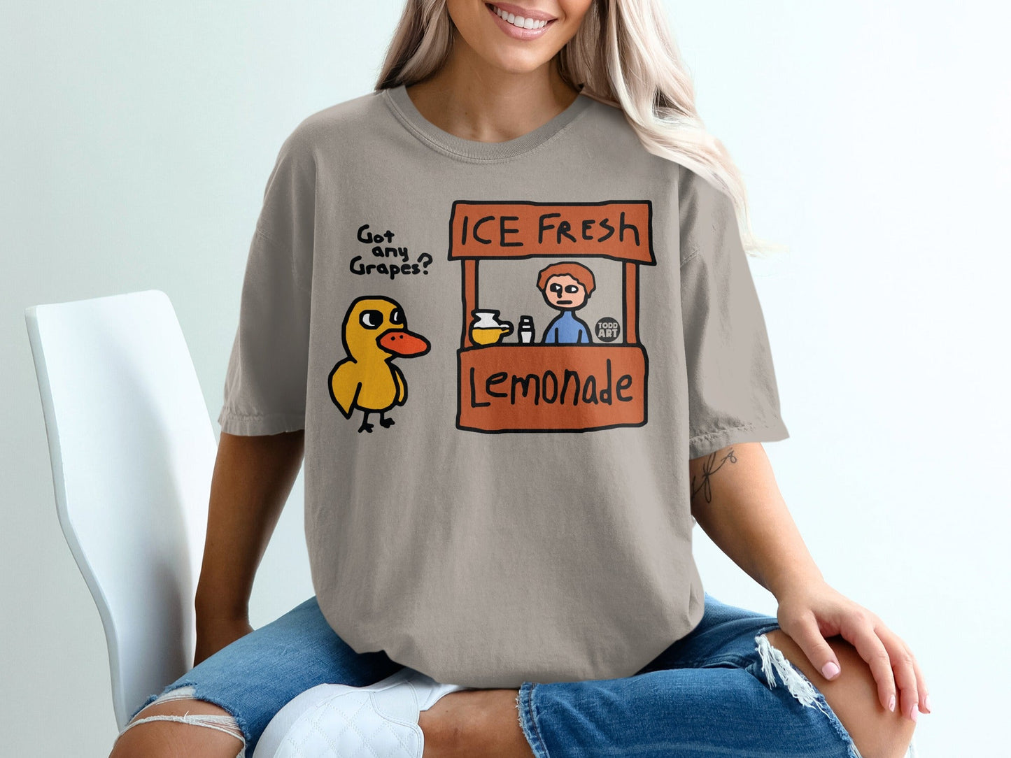 Cartoon duckling at an "ICE FRESH Lemonade" stand with text "Got any grapes?".