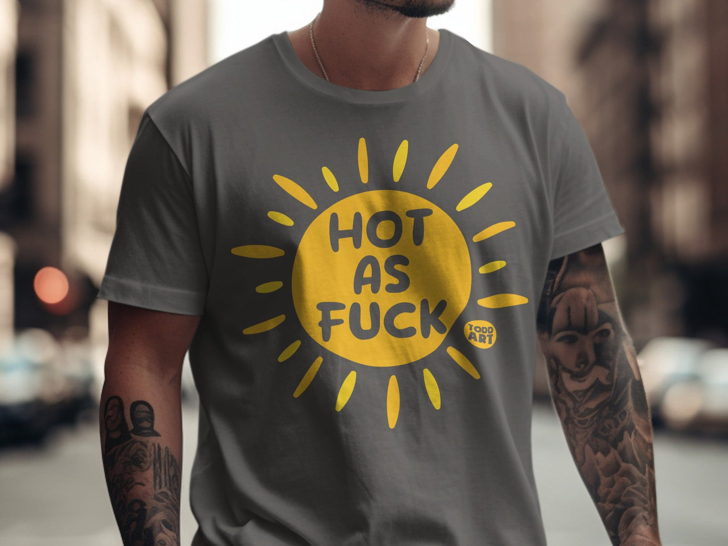 Dark grey t-shirt with yellow "Hot as Fuck" sun graphic and "TODD ART" logo.