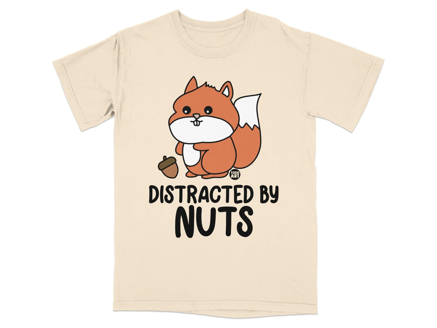Cream t-shirt with cartoon squirrel holding acorn, text reads "DISTRACTED BY NUTS".