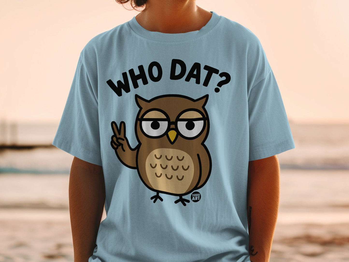 Light blue t-shirt with cartoon owl and "Who Dat?" text.