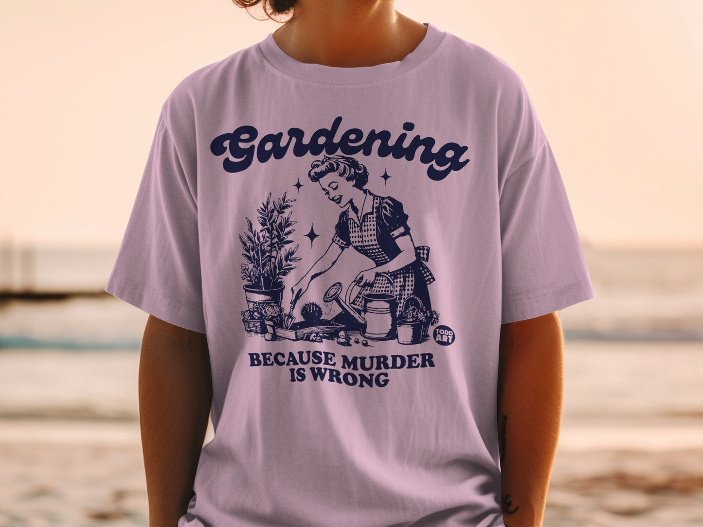 Graphic tee with "Gardening Because Murder Is Wrong" text and vintage gardening illustration.