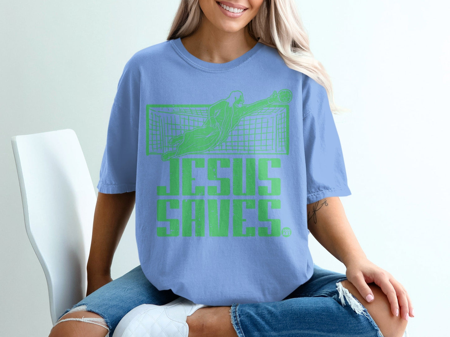 Blue t-shirt with "JESUS SAVES." text and a soccer goalie.