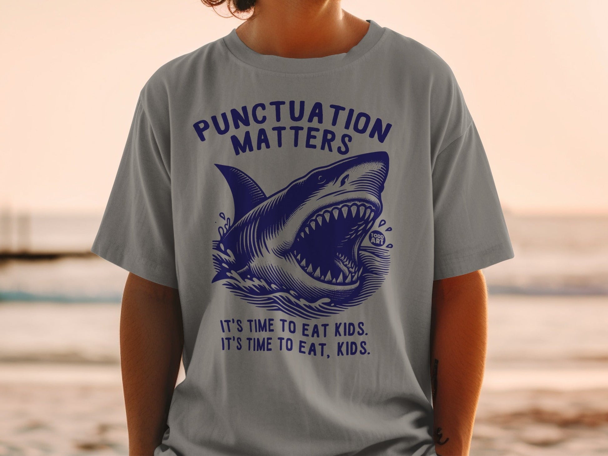 Shark graphic with text "Punctuation Matters" and "It's time to eat kids. It's time to eat, kids."