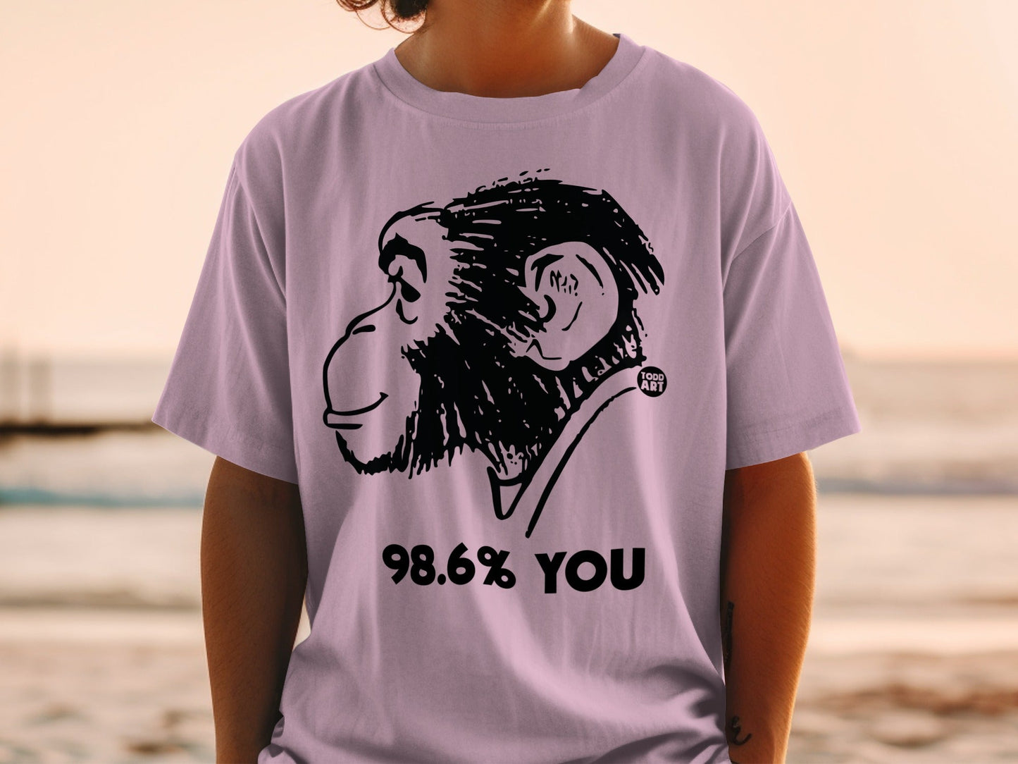 T-shirt with a black monkey graphic and "98.6% YOU" text.
