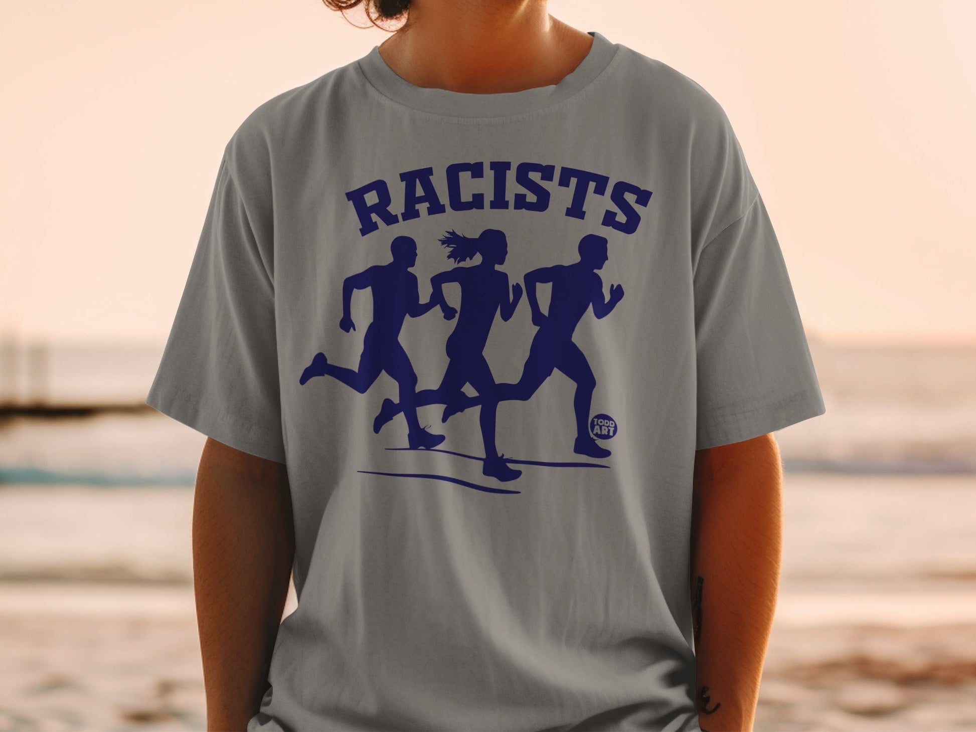 Gray t-shirt with "RACISTS" and three running silhouettes in navy blue.