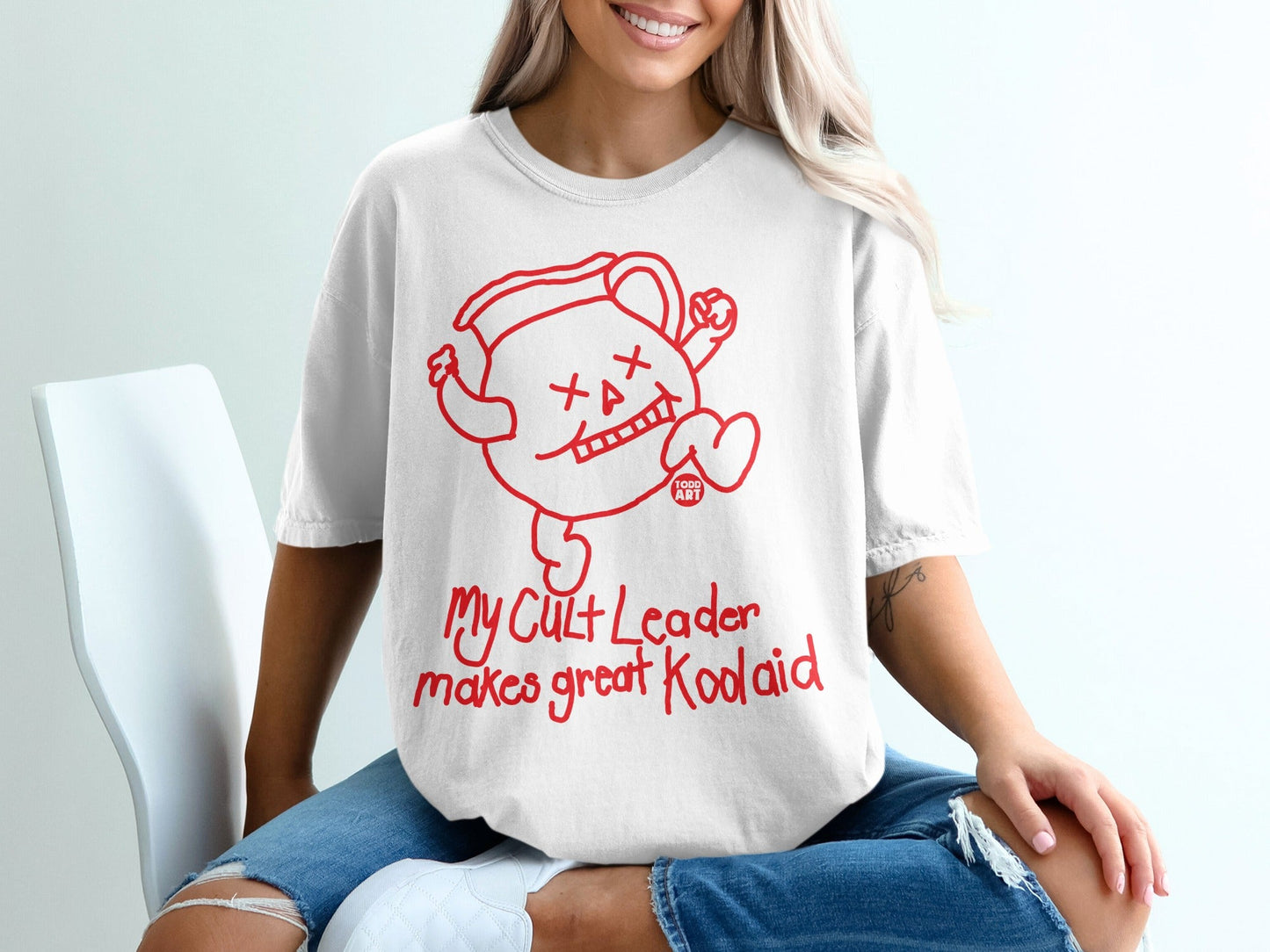 White t-shirt with Kool-Aid Man character and "My Cult Leader makes great Koolaid" text.