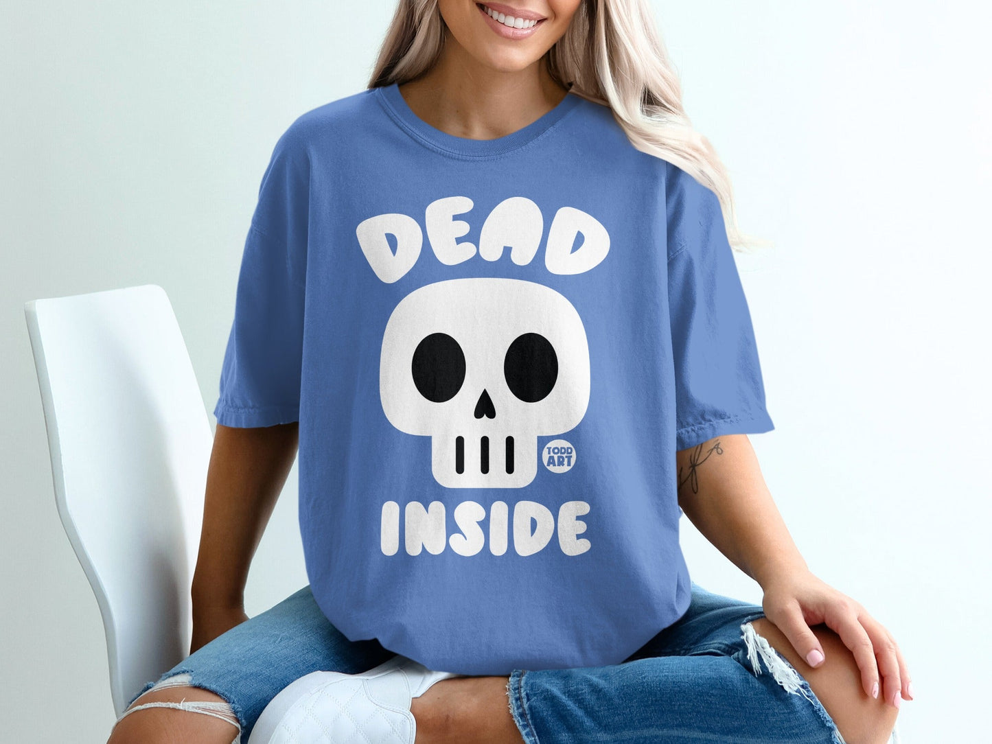 Blue t-shirt with a white skull and "DEAD INSIDE" text.