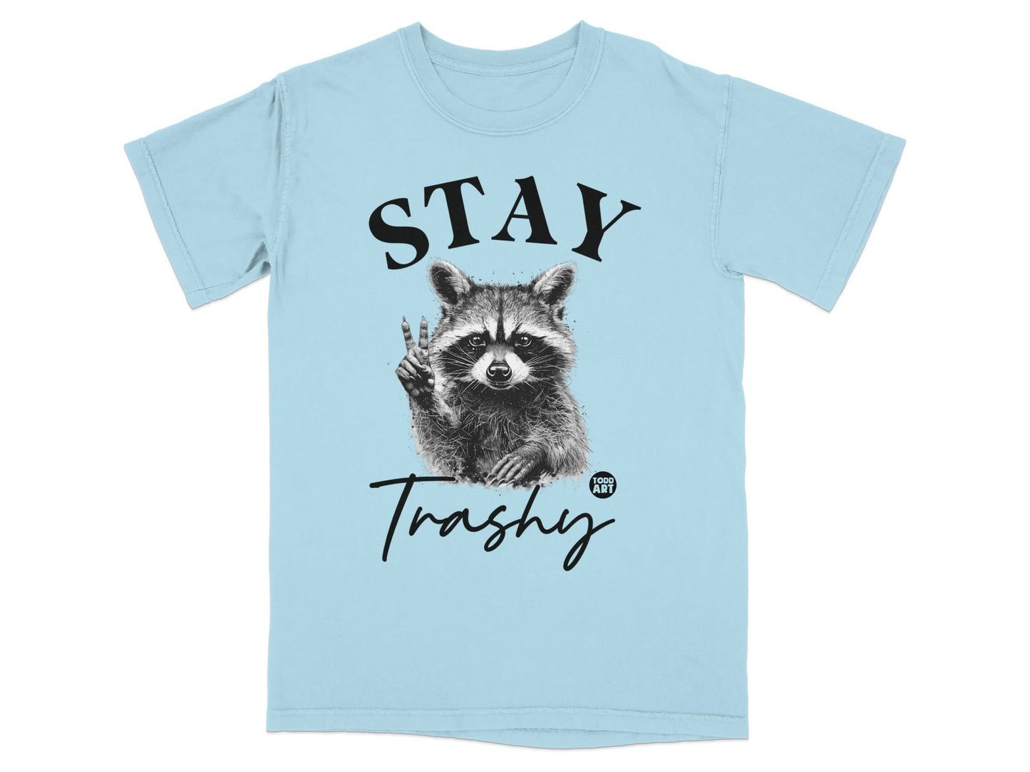 Light blue t-shirt with "STAY Trashy" and a raccoon giving a peace sign.