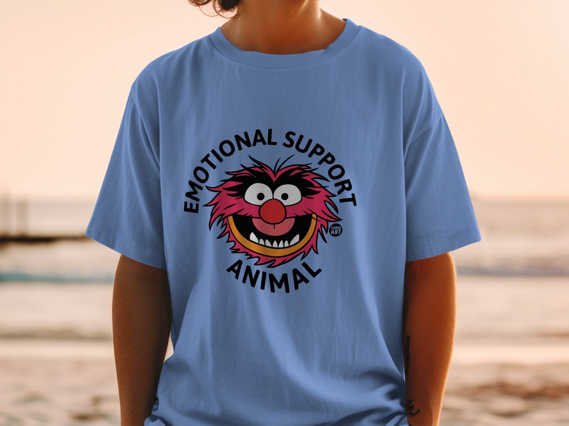 Blue t-shirt with "Emotional Support Animal" text and cartoon animal character.