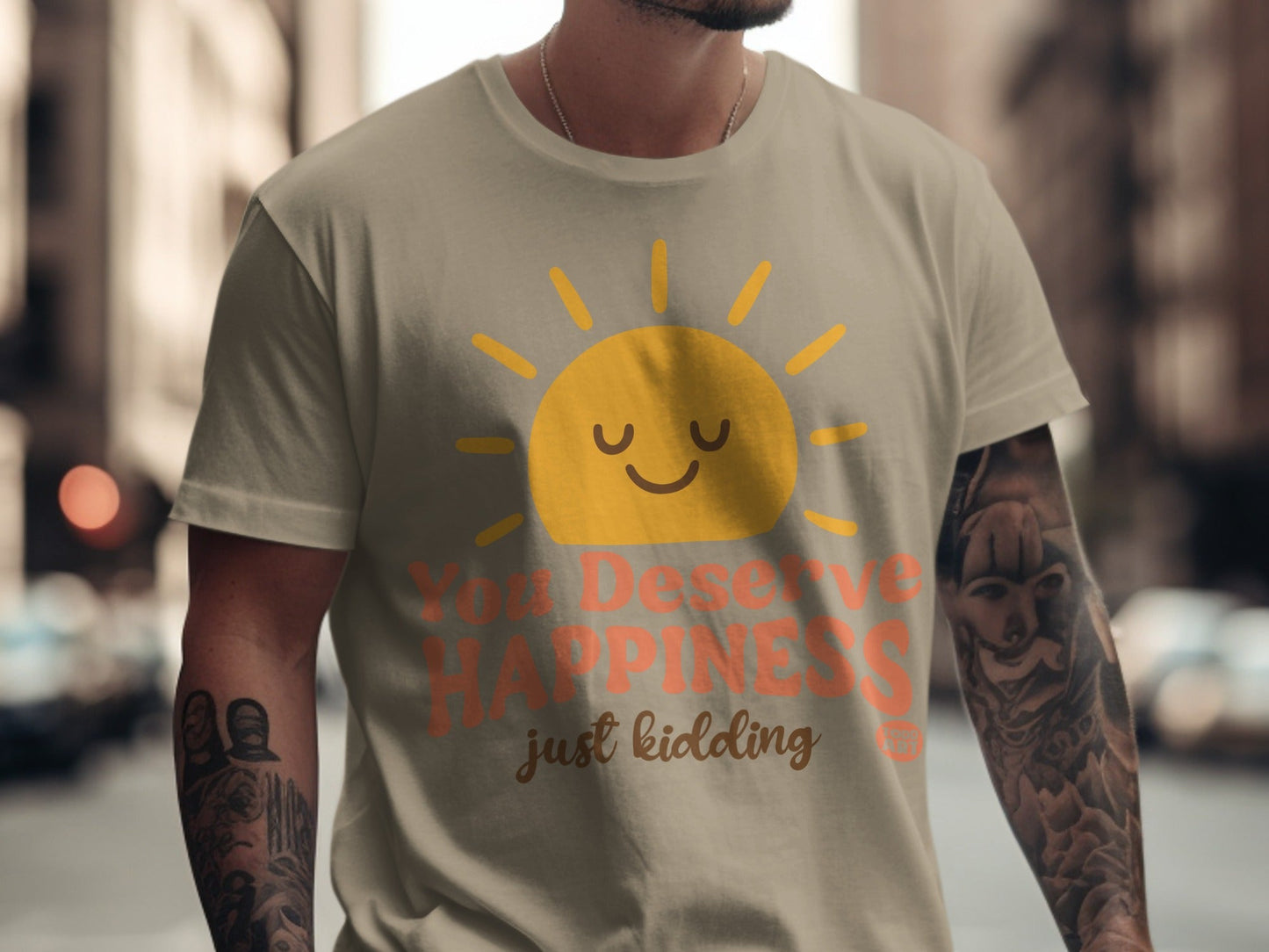 T-shirt with sun graphic and text "You Deserve Happiness just kidding".
