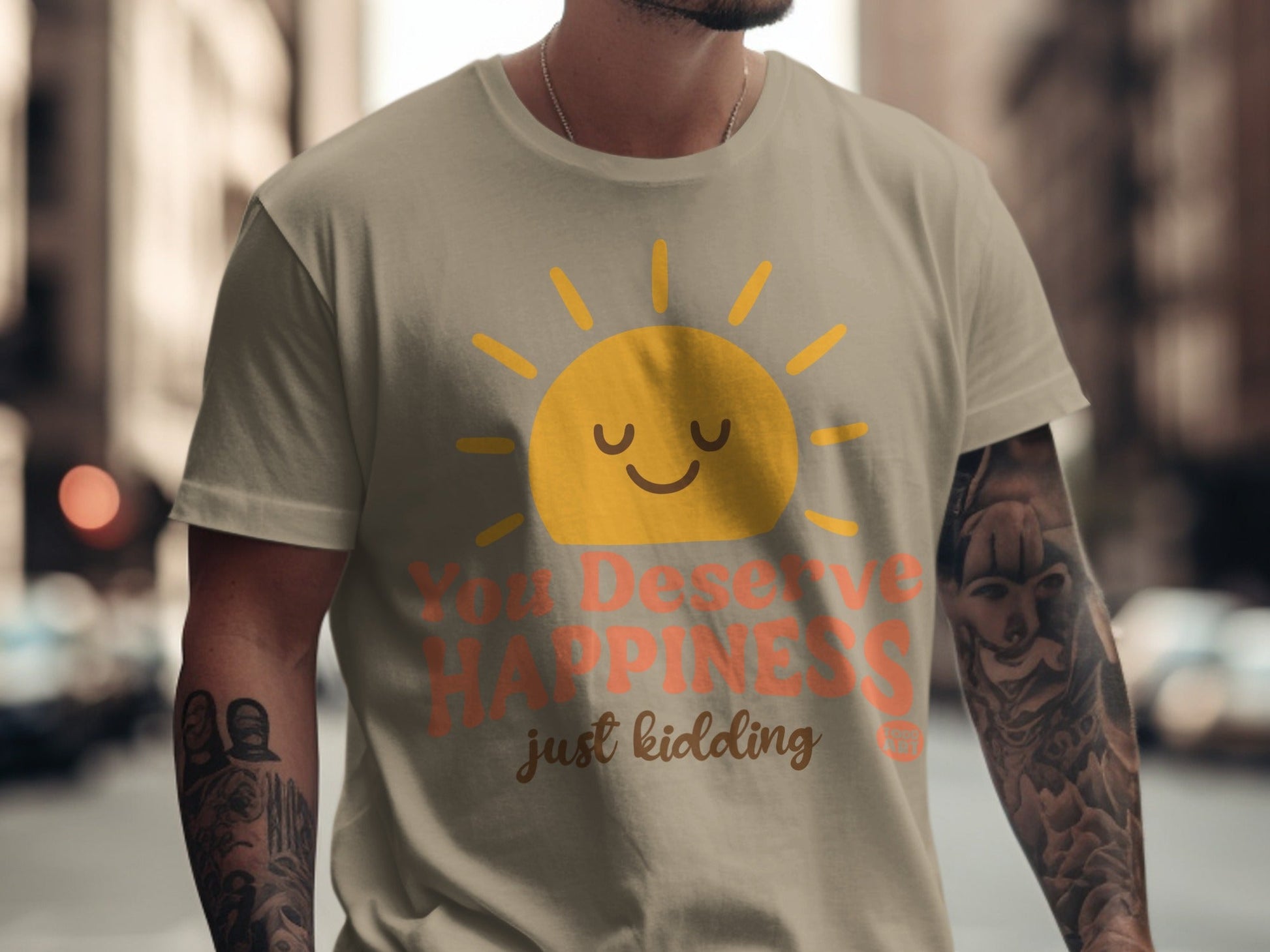 T-shirt with sun graphic and text "You Deserve Happiness just kidding".