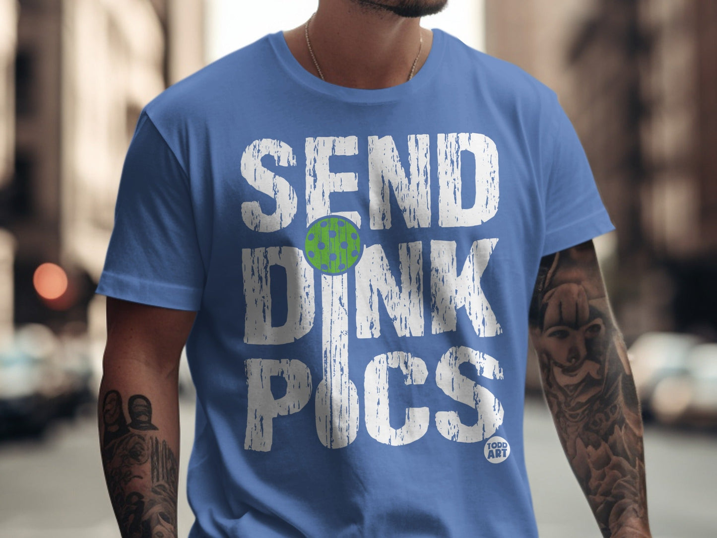 Blue t-shirt with "SEND DINK PICS" and a pickleball graphic.