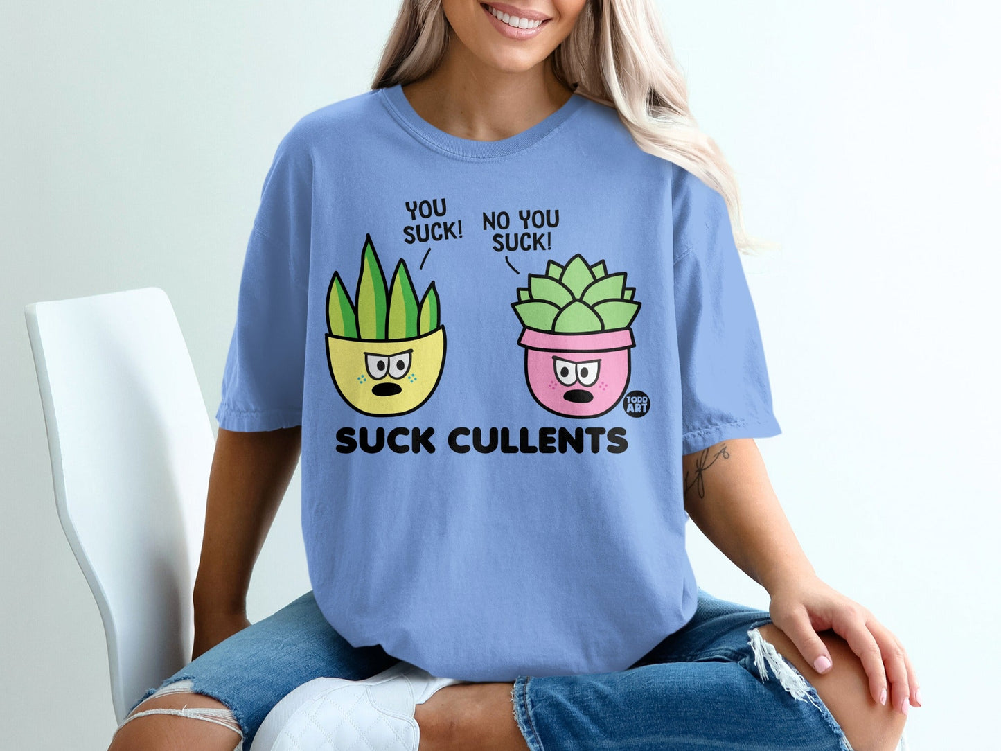 T-shirt with cartoon succulents saying "You suck!" and "No you suck!".
