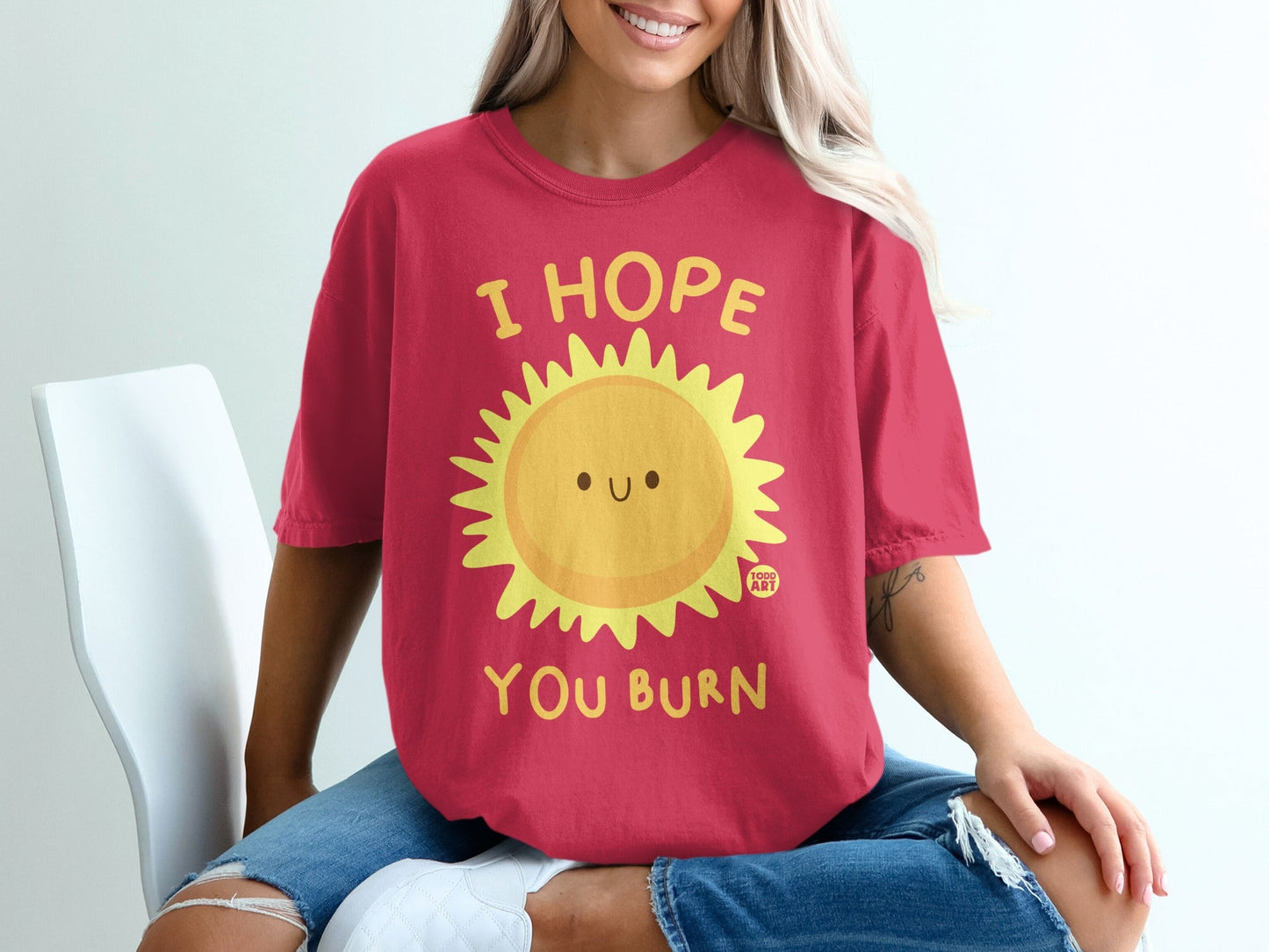 Red t-shirt with a smiling sun graphic and text "I HOPE YOU BURN".