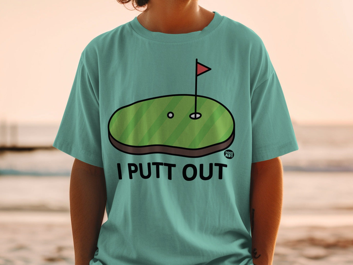 Green golf putting green with hole and flag, text "I PUTT OUT".