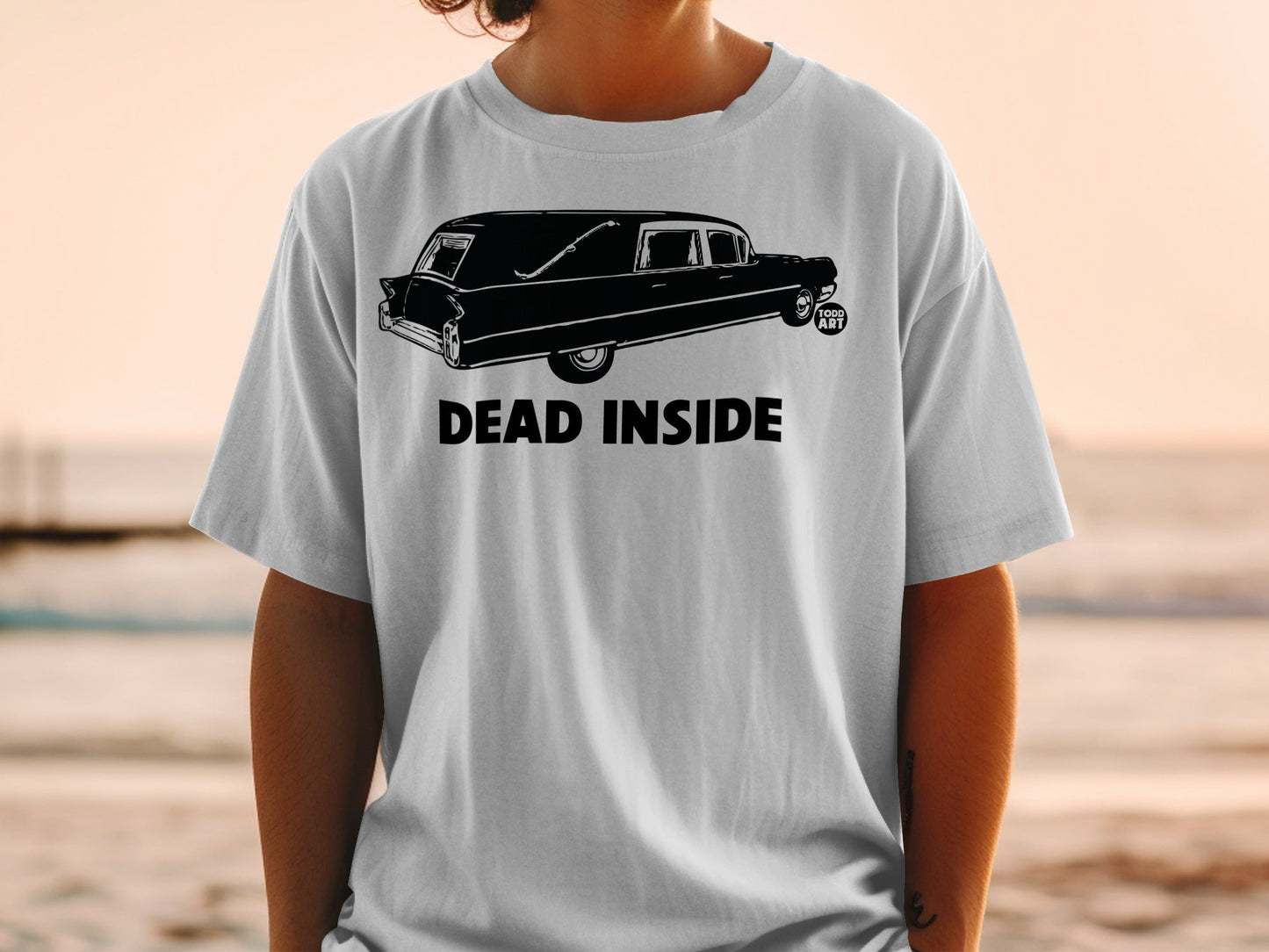 T-shirt with black hearse graphic and "DEAD INSIDE" text.