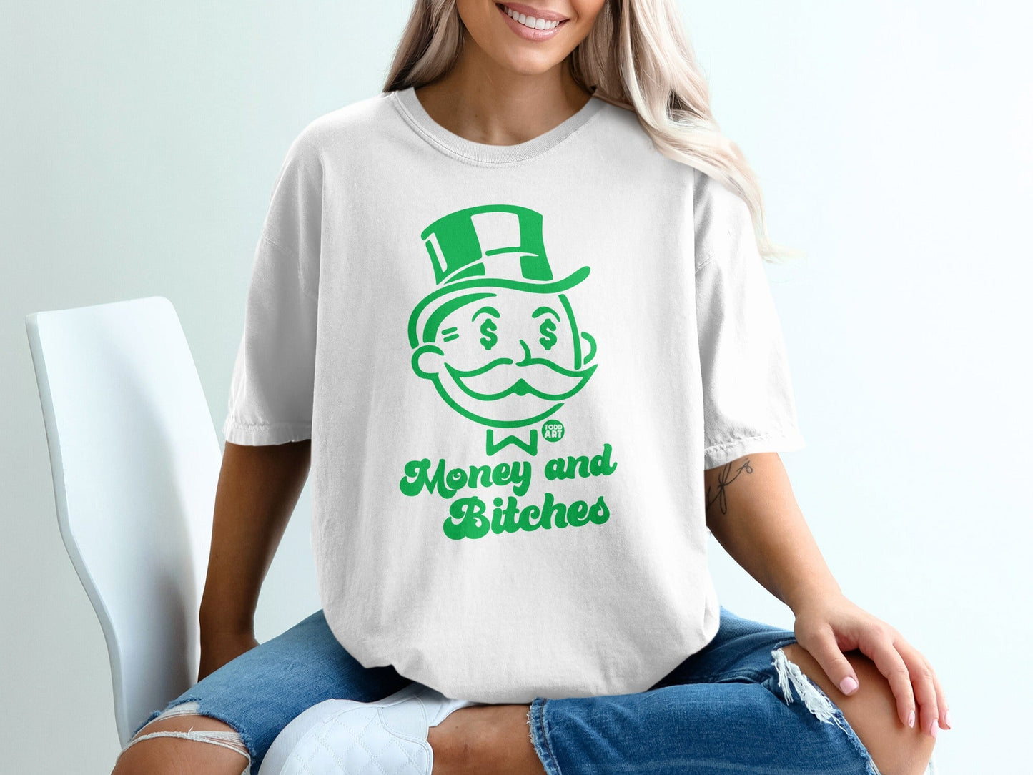 White t-shirt with green Monopoly man graphic and "Money and Bitches" text.