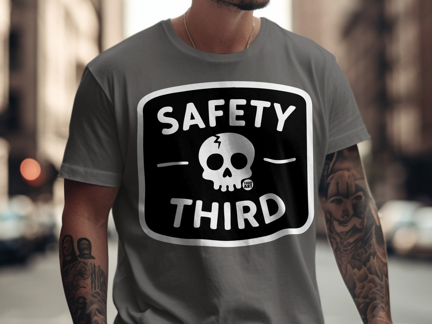 Gray t-shirt with "SAFETY THIRD" and a skull graphic.