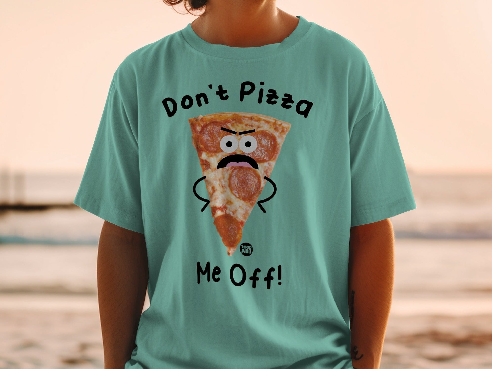 T-shirt with a cartoon pizza slice saying "Don't Pizza Me Off!".