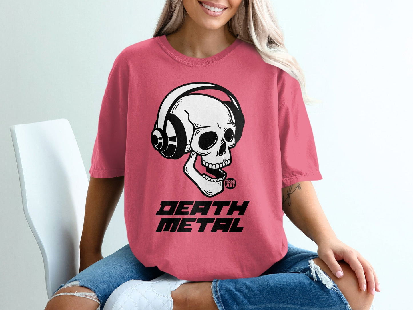 Pink t-shirt with skull wearing headphones and "Death Metal" text.