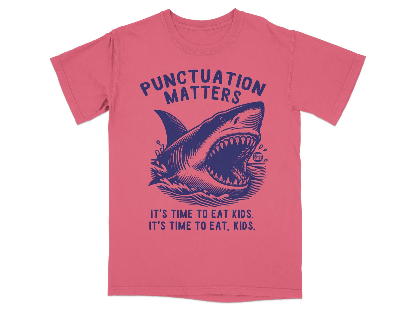 Blue shark graphic on pink t-shirt, "Punctuation Matters. It's time to eat kids. It's time to eat, kids."