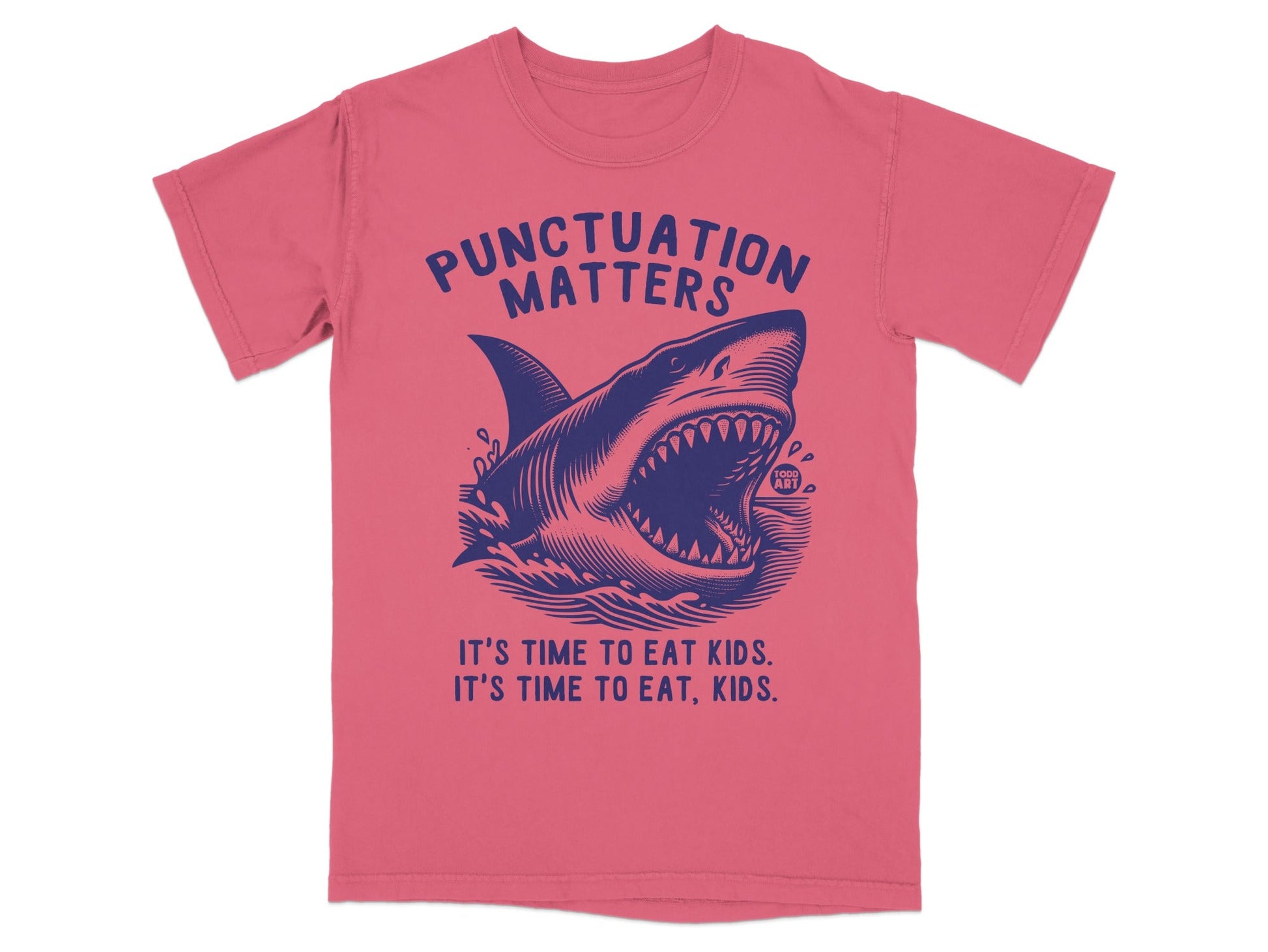 Blue shark graphic on pink t-shirt, "Punctuation Matters. It's time to eat kids. It's time to eat, kids."