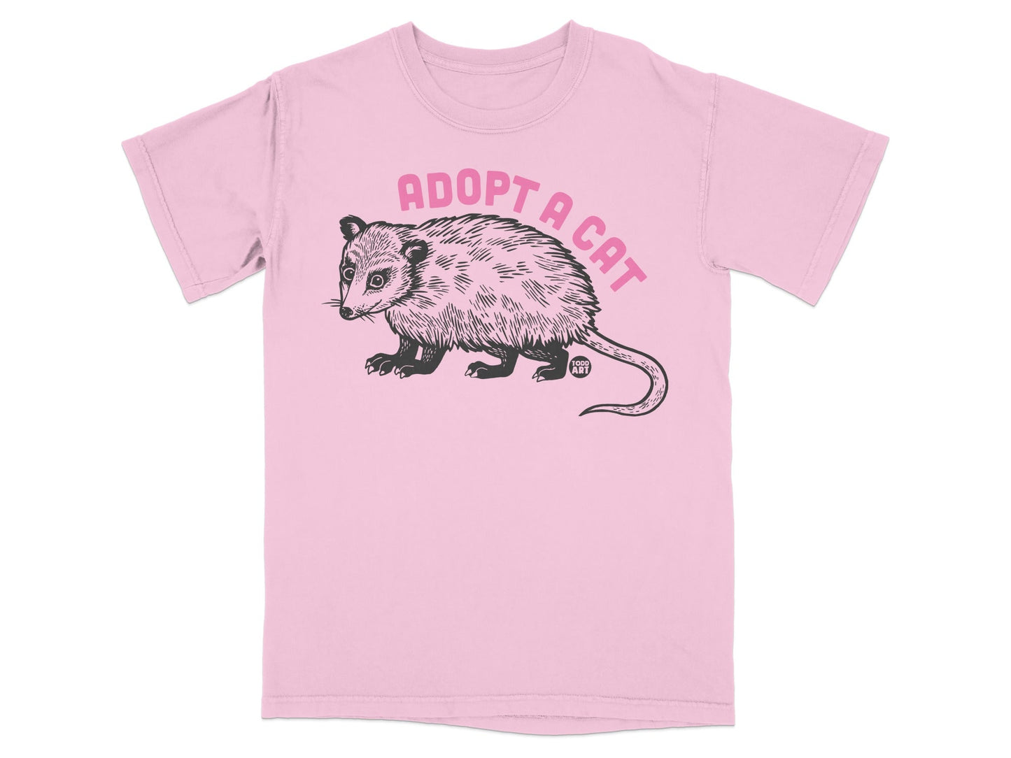 Pink t-shirt with black opossum illustration and "Adopt a Cat" text.