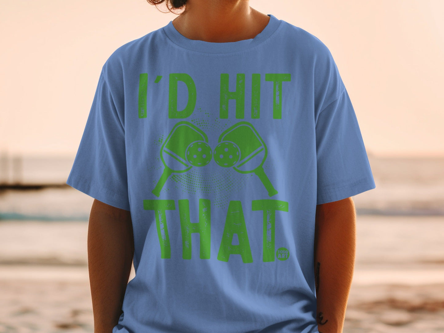 Blue t-shirt with green text and pickleball graphic.