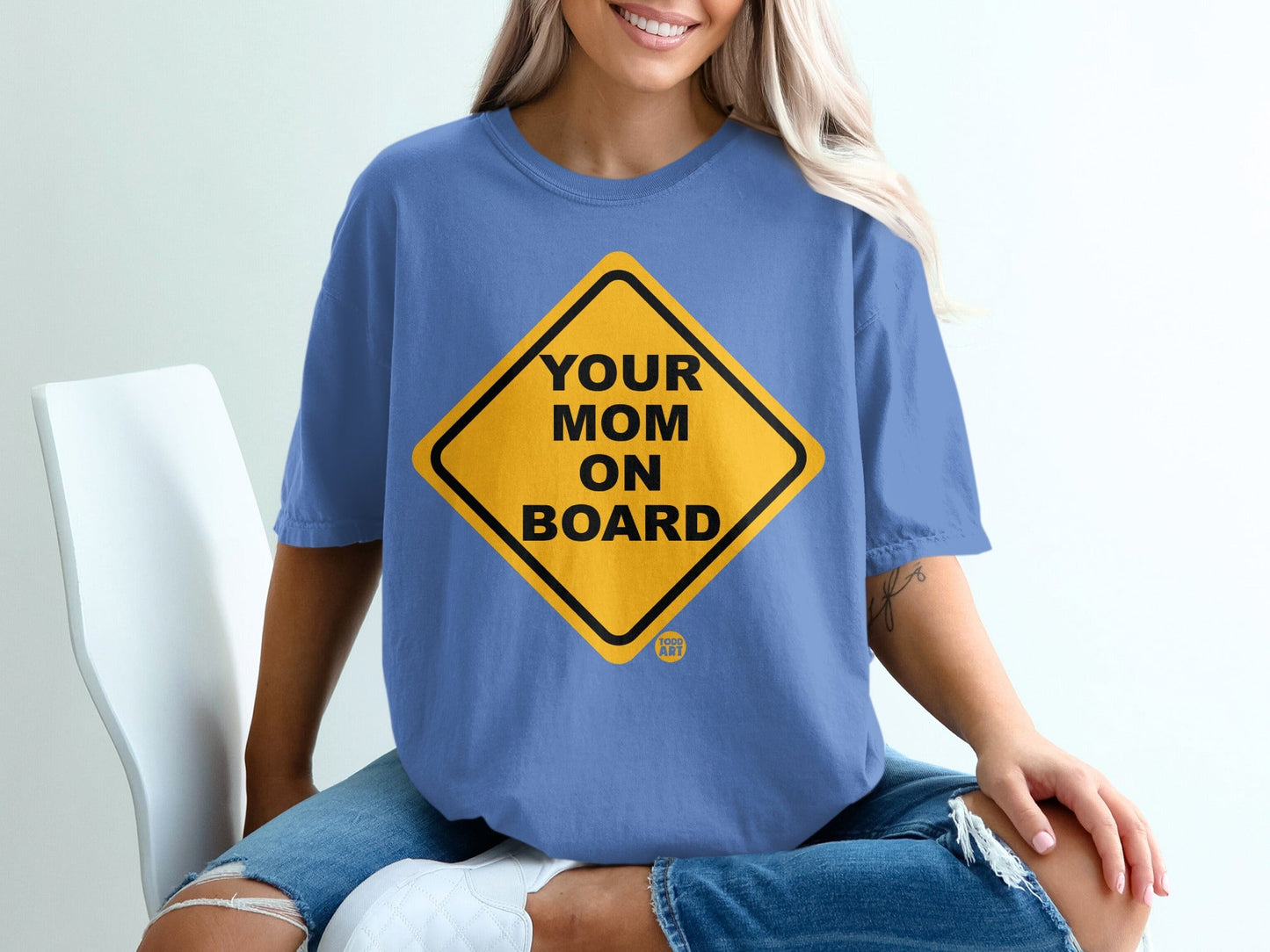 Yellow diamond sign with black border reads "YOUR MOM ON BOARD"